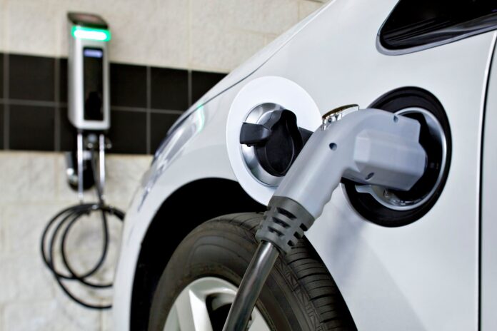 Close up of an electric car charging port.