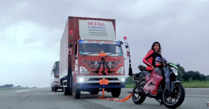 Watch rider attempt to tow 7-ton truck with her electric motorcycle