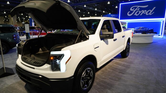 Ford to delay production of new electric pickup and large SUV as US EV sales growth slows
